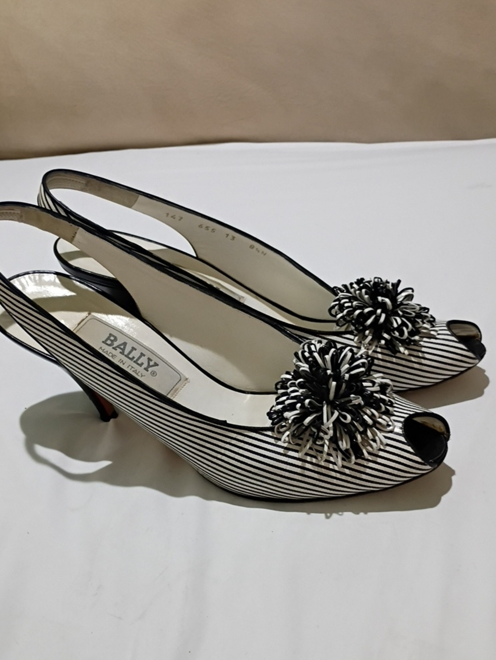 Bally Black and White Striped Peep-Toe Slingback Pumps with Pom Detail